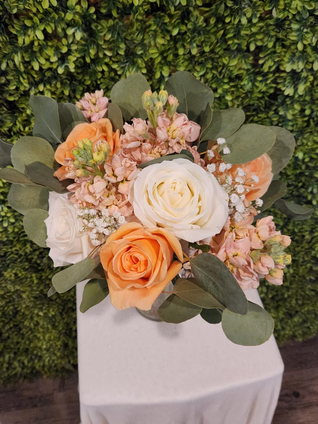 Mixed Flower Clutch With Roses Starting at $70.00